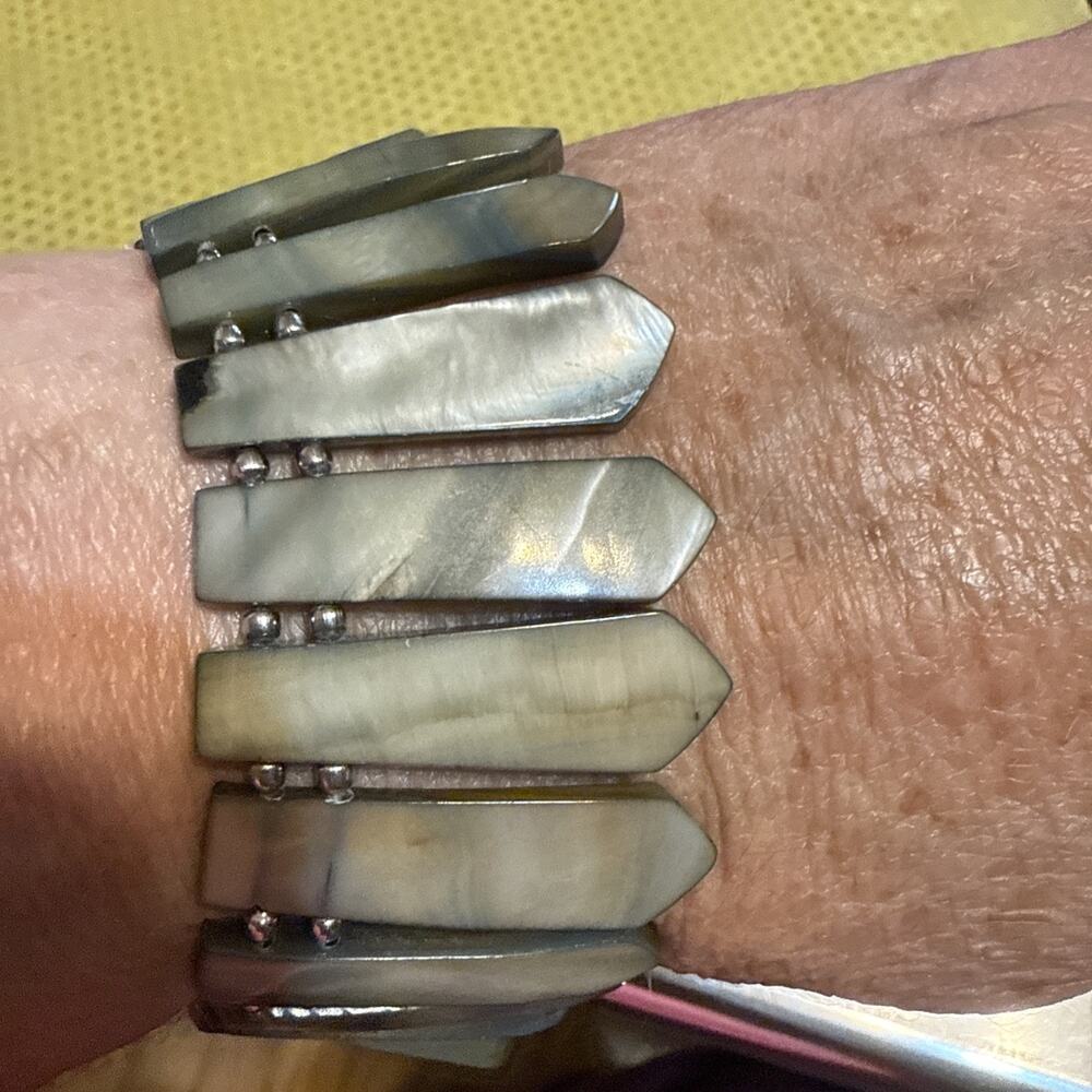 Bracelet made of grey, possibly mother-of-pearl or shell, dagger or leaf-shaped